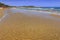 Apulia beach: Bay of Sfinale, between Peschici and Vieste, with an ancient Torre Saracena, typical lookout tower of the coast of G