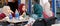 Aqaba, Jordan, March 7, 2018: Young ladies relax with soft drinks in a street restaurant in the sun in the center of Aqaba