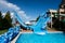 Aqua Paradise Nessebar, Bulgaria - June 19, 2023: Blue water slide in a children\\\'s aquapark on a sunny day