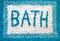 Aqua and white coloured bath mat.