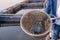 Aquaculture farmers feeding river tilapia. Fish feed in a hand at fish farm in the Mekong River. Commercial aquaculture