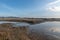 Aquaculture farms and saline alkali land by the sea under the blue sky