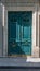 Aquamarine color door of old building with golden shiny doorknobs and details. Vintage ornate wooden door painted in sea-green