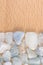 Aquamarine heap stones texture on half light varnished wood background. Place for text