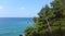 Aquamarine water of Adriatic sea and green pines in Montenegro