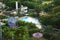 Aquapark in Asia. Swimming pool, sun loungers next to the garden and monorail