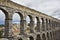 The aqueduct and ancient Segovia in cloudy May day