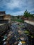 Aqueduct Full Of Garbage And Waste by the Ozama River in Poor Los Guandules Neighborhood