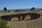 Aqueduct In Roman City Baelo Claudia Dating In The 2nd Century BC Beach Of Bologna In Tarifa. Nature, Architecture, History,