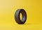 Ð¡ar tire on a yellow background