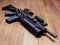 AR15 rifle with grenade launcher on the wooden floor