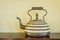 Arab antique teapot on a wood table