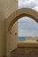 Arab architecture arch against blue sky and sea