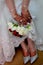 Arab bride holding a wedding bouquet