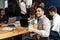 Arab businesman sitting at desk showing thumbs up gesture