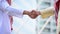 Arab businessman shaking hands together. Teamwork business partner wear muslim dress shake hands with partnership concept. Success