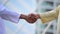 Arab businessman shaking hands together. Teamwork business partner wear muslim dress shake hands with partnership concept. Success