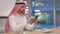 Arab Businessman using Smartphone at Work