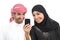 Arab couple sharing social media on the smart phone