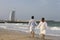 Arab couple walking on the beach
