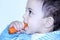 Arab egyptian baby girl eating carrot