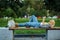 Arab female student lying on the bench in park