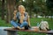 Arab female student sitting on the bench in park