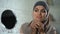 Arab female trying new hijab, traditional headscarf, islamic modesty standards