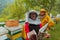 Arab investitor with an experienced senior beekeeper checking the quality and production of honey at a large bee farm