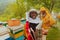 Arab investitor with an experienced senior beekeeper checking the quality and production of honey at a large bee farm