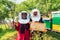 Arab investors checking the quality of honey on a large honey farm in which they invested their money. The concept of