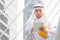 Arab man Construction civil engineer at building construction site, Young Saudi skilled professional engineer