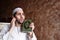 Arab muslim man with Koran islamic holy book and headset