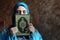 Arab muslim woman with Koran islamic holy book and headset