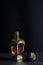 Arab perfume in a bottle, isolated in black background, in low l