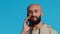 Arab person answering phone call in front of camera