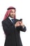 Arab saudi executive smiling and using a smart phone