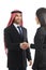 Arab saudi happy businessman handshaking in a negotiation