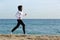 Arab saudi runner woman running on the beach