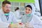 Arab students with hijab while working on the denture, false teeth.