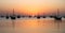 Arab traditional dhows in the shore during the sunrise in Qatar