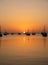 Arab traditional dhows in the shore during the sunrise in Qatar