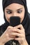 Arab woman addicted to the smartphone