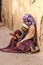 Arab woman with a child begging