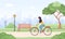 Arab woman in hijab on bicycle rides around city. Spring or summer landscape. Cute happy young girl on bike at park