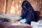 Arab woman makes bread in the beduin village in Egypt