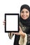 Arab woman showing a tablet display application isolated