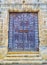 An Arab wooden door of a Mosque with the shape of Horseshoe arch