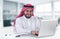 Arabian businessman using laptop in office