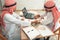 Arabian businessmen are signing contract agreement after success